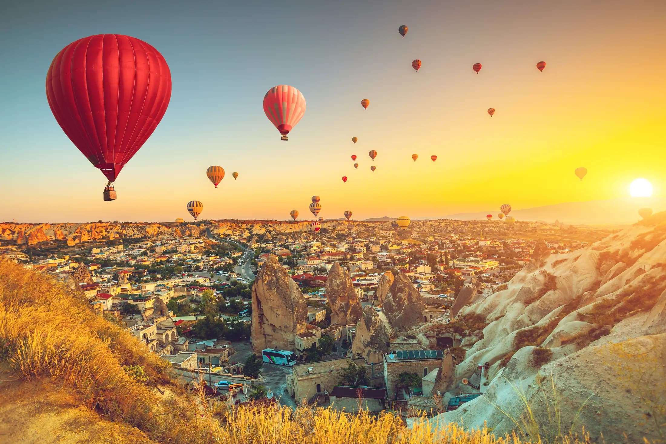 Hot-air balloons over Cappadocia at sunrise